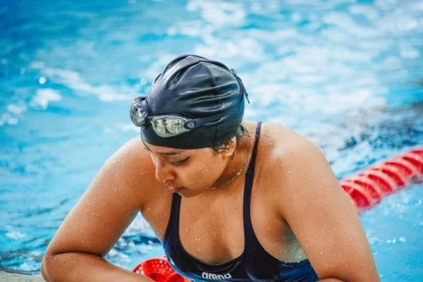 female swimmer training pool
